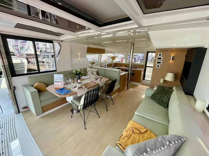 Slide: The Image of Luxurious interior of 2026 Bali 4.2 yacht with modern dining and seating area. - 3
