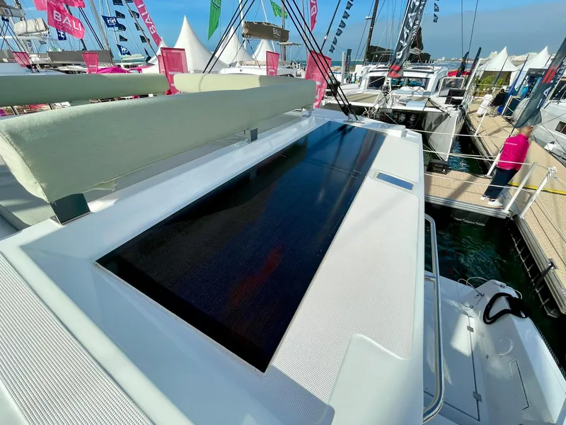 Slide: The Image of Modern Bali 4.2 yacht deck with solar panel, docked at marina, 2026 model. - 32