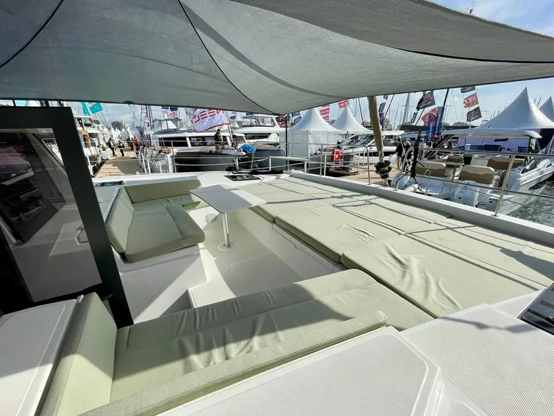 Slide: The Image of Luxurious Bali 4.2 yacht deck with sun loungers and canopy, 2026 model. - 34