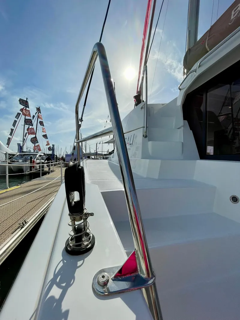 Slide: The Image of 2026 Bali 4.2 yacht deck with sunlight and marina view. - 38