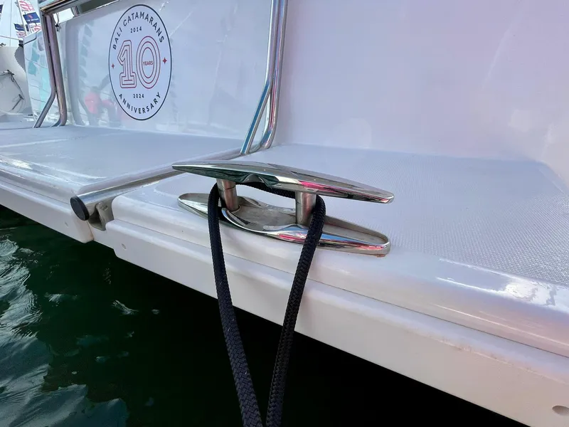 Slide: The Image of Bali 4.2 boat cleat with rope, 2026 model, docked on water. - 41