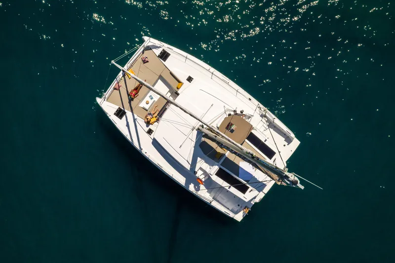 Slide: The Image of Aerial view of a 2026 Bali 4.2 catamaran sailing on clear blue water. - 43