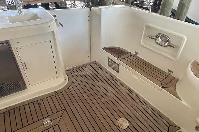 Slide: The Image of Outdoor kitchenette on 1999 McKinna 57 Pilothouse yacht with sink and storage. - 14