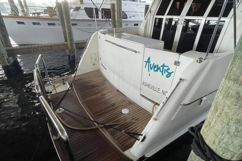 Slide: The Image of 1999 McKinna 57 Pilothouse interior with helm, seating, and navigation equipment. - 16