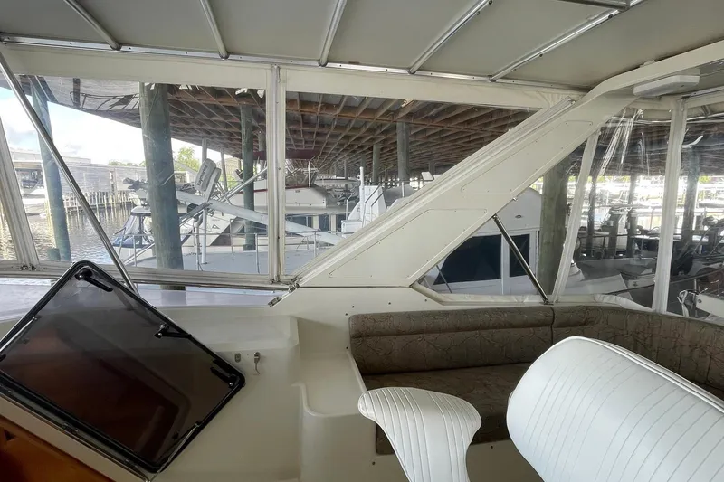 Slide: The Image of Luxurious seating area on a 1999 McKinna 57 Pilothouse yacht with elegant upholstery. - 20