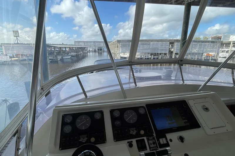 Slide: The Image of 1999 McKinna 57 Pilothouse helm with navigation instruments and steering wheel. - 22
