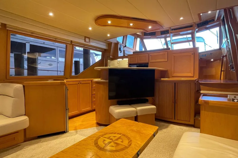 Slide: The Image of Luxurious interior of 1999 McKinna 57 Pilothouse yacht with leather seating and modern amenities. - 27
