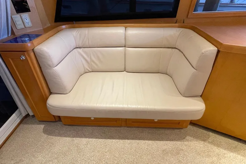 Slide: The Image of 1999 McKinna 57 Pilothouse interior with wooden flooring and helm station. - 29