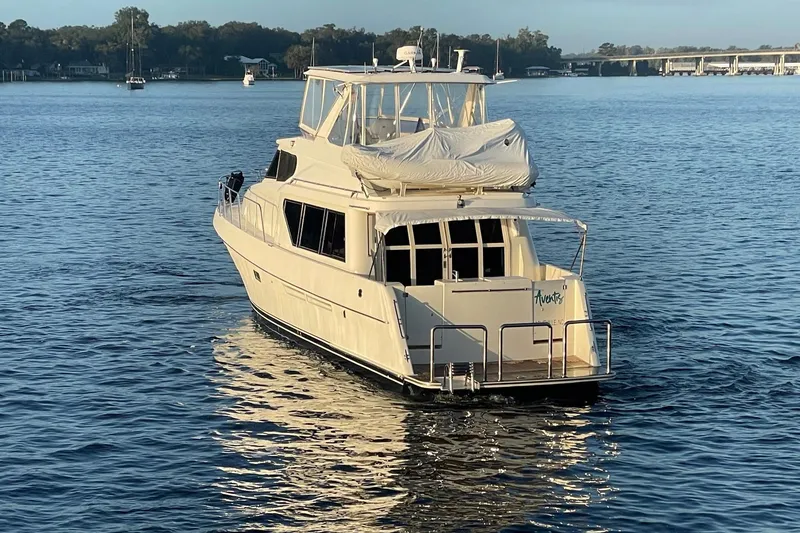Slide: The Image of 1999 McKinna 57 Pilothouse yacht cruising on calm waters. - 3