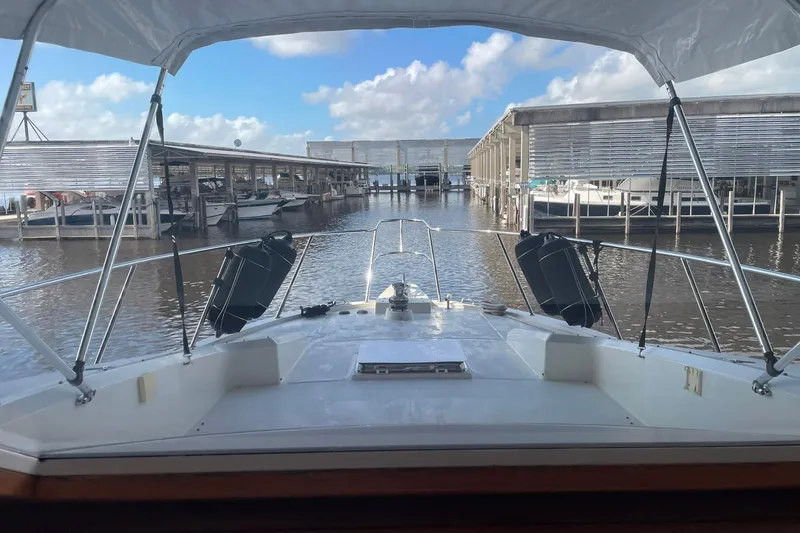 Slide: The Image of Navigation equipment on 1999 McKinna 57 Pilothouse, featuring Garmin displays and compass. - 37