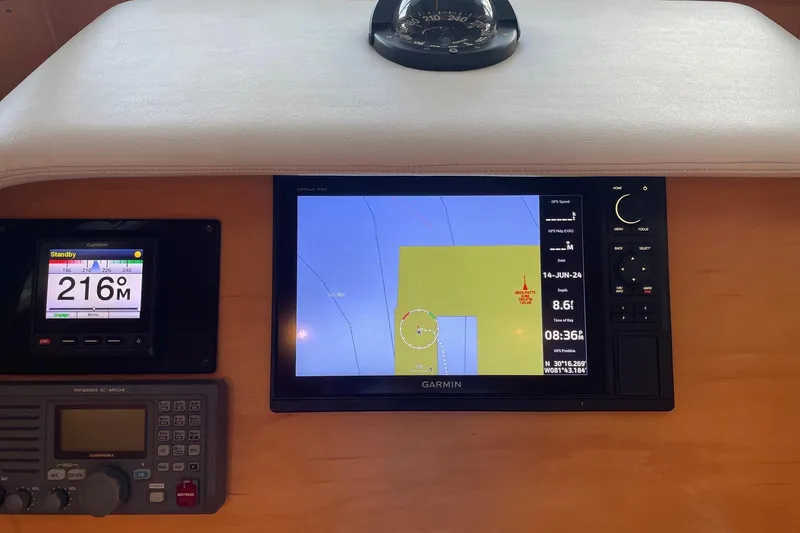 Slide: The Image of Control panel of a 1999 McKinna 57 Pilothouse yacht with various switches and indicators. - 38