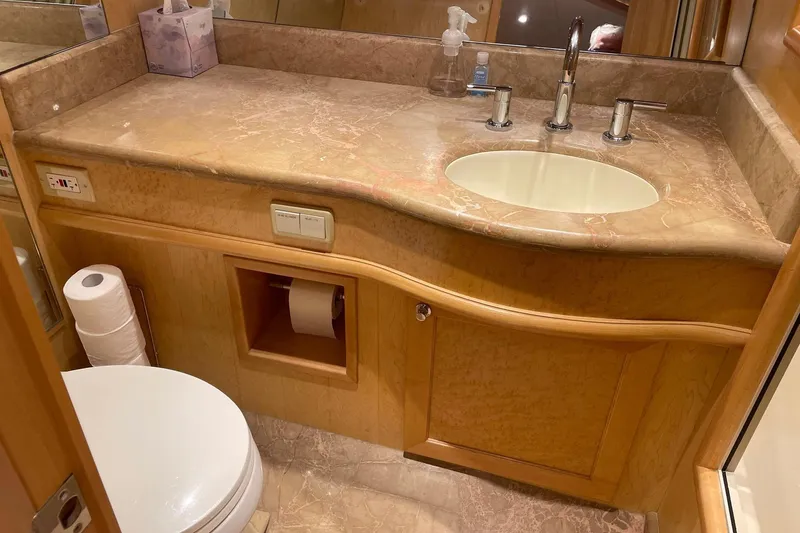 Slide: The Image of Luxurious bathroom interior of 1999 McKinna 57 Pilothouse yacht with wooden cabinetry. - 44