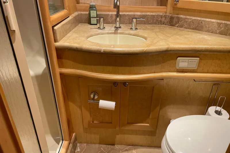 Slide: The Image of Shower and sink area in 1999 McKinna 57 Pilothouse yacht bathroom. - 49