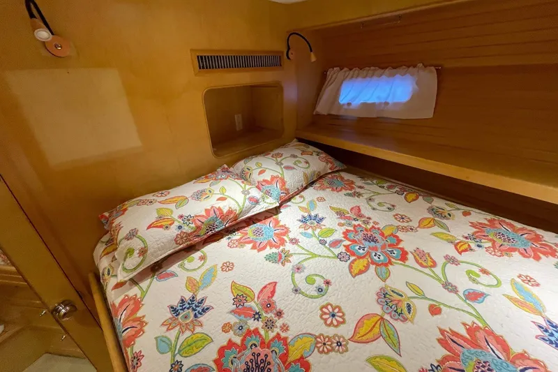 Slide: The Image of Cozy cabin interior of 1999 McKinna 57 Pilothouse with floral bedding. - 51