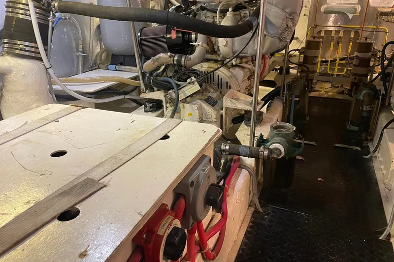 Slide: The Image of Engine room of 1999 McKinna 57 Pilothouse with fire extinguisher and equipment. - 56