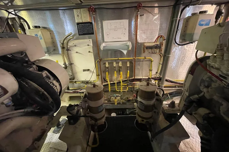 Slide: The Image of Engine room of 1999 McKinna 57 Pilothouse with equipment and wiring. - 61