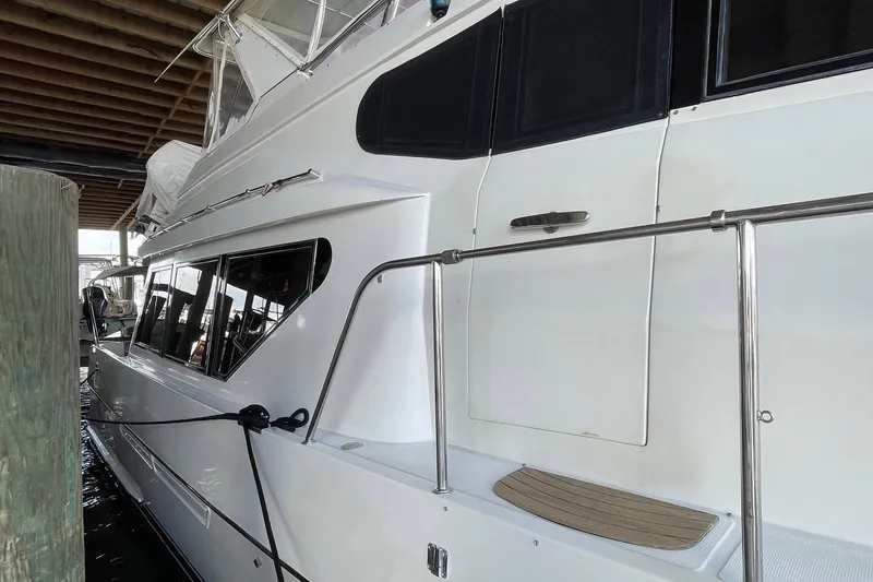 Slide: The Image of 1999 McKinna 57 Pilothouse yacht under wooden roof structure. - 8