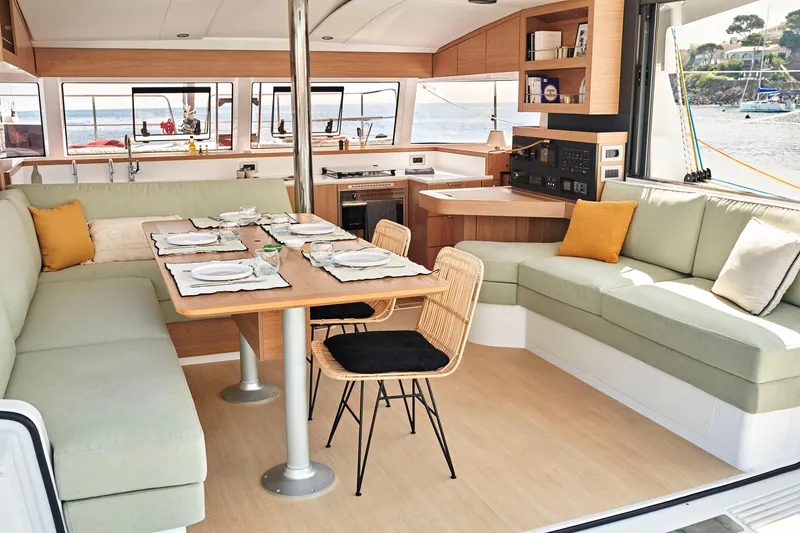 Slide: The Image of Luxurious Bali CATSMART 2026 yacht interior with elegant dining area and scenic ocean view. - 10