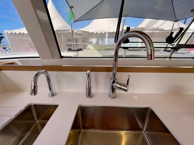 Slide: The Image of Modern kitchen sink with three chrome faucets on a Bali CATSMART 2026 yacht. - 16