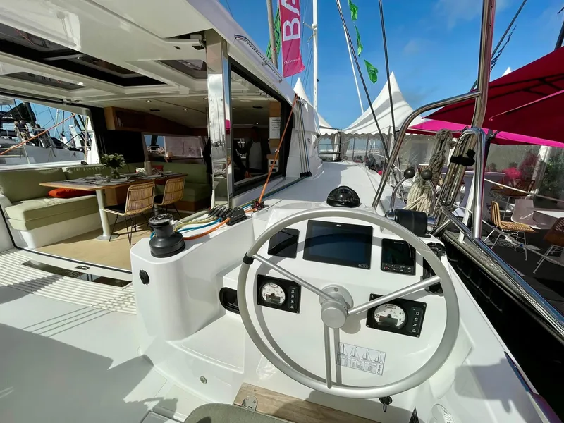 Slide: The Image of Modern Bali CATSMART 2026 yacht interior with helm, spacious seating, and open deck under clear skies. - 29