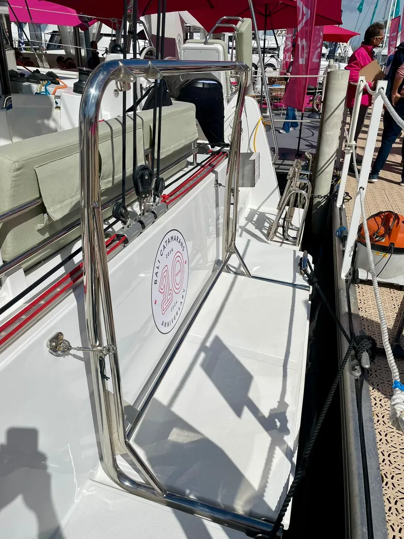 Slide: The Image of Bali CATSMART 2026 yacht deck with chrome railing and logo, docked at marina. - 33