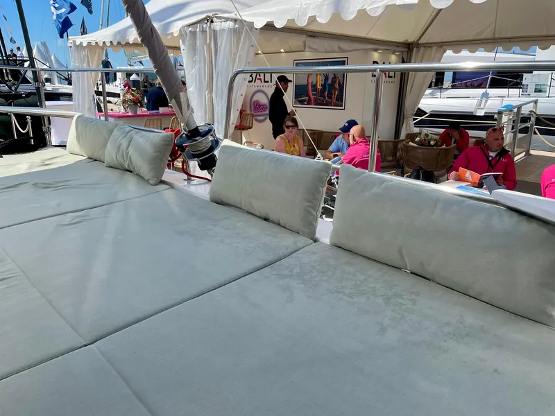 Slide: The Image of Luxurious Bali CATSMART 2026 yacht deck with comfortable seating at a marina event. - 35