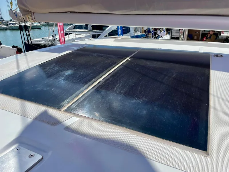 Slide: The Image of Solar panels on a 2026 Bali CATSMART yacht, docked at a marina. - 36