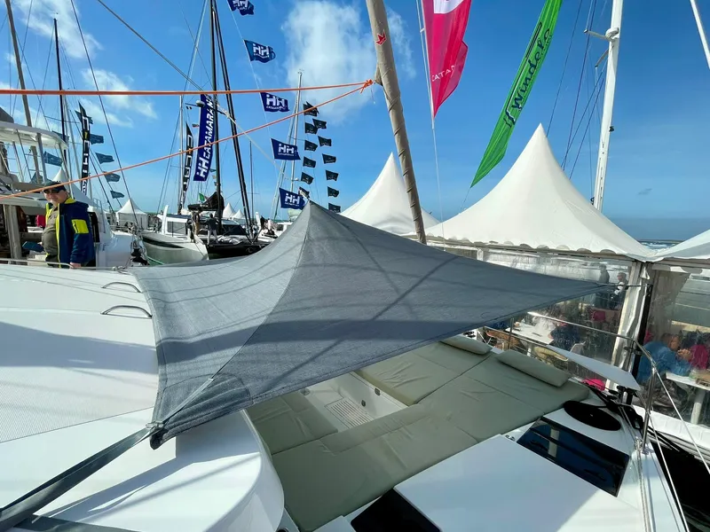 Slide: The Image of Sailboat with sunshade at marina, featuring Bali CATSMART 2026 model. - 37