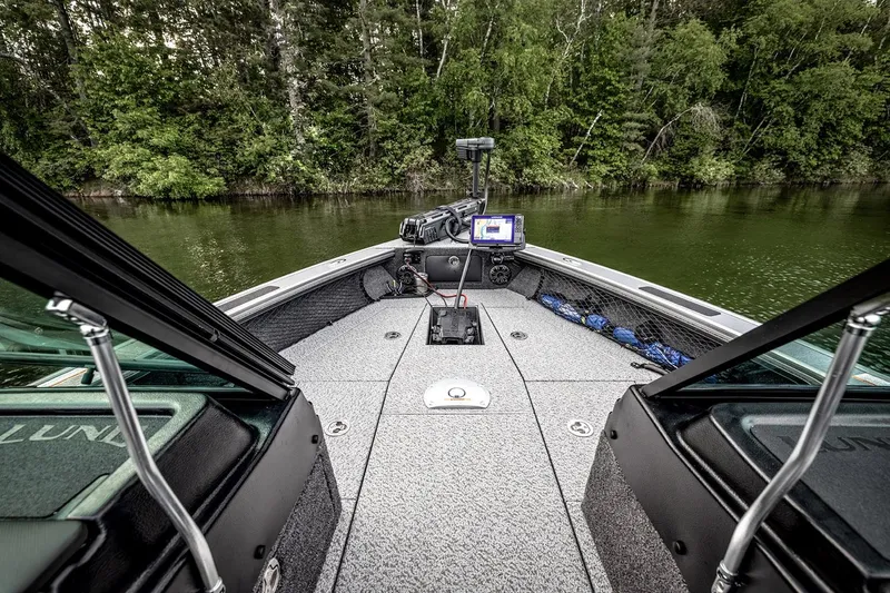 Slide: The Image of Manufacturer Provided Image: 2025 Lund 1875 Pro-V boat interior with advanced navigation system on a serene lake. - 4