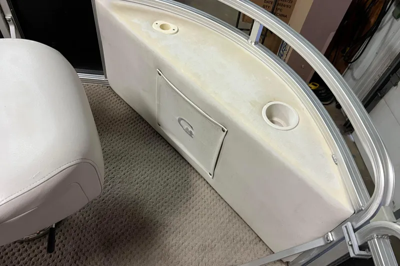 Slide: The Image of Interior of 2014 Avalon Grand Island 2485 QF boat with seating and storage compartment. - 10