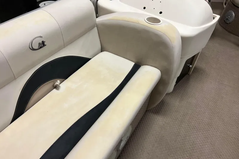 Slide: The Image of 2014 Avalon Grand Island 2485 QF boat interior with beige and black seating. - 13