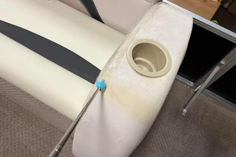 Slide: The Image of 2014 Avalon Grand Island 2485 QF boat seat with cup holder and cleaning tool. - 15