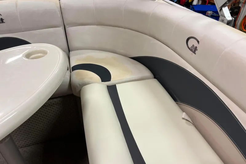 Slide: The Image of 2014 Avalon Grand Island 2485 QF boat interior with white and gray seating. - 19
