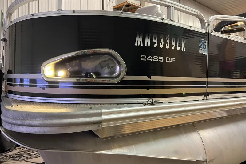 Slide: The Image of 2014 Avalon Grand Island 2485 QF pontoon boat in a storage facility. - 29