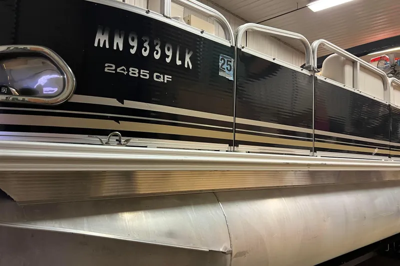 Slide: The Image of 2014 Avalon Grand Island 2485 QF pontoon boat in storage, side view. - 31