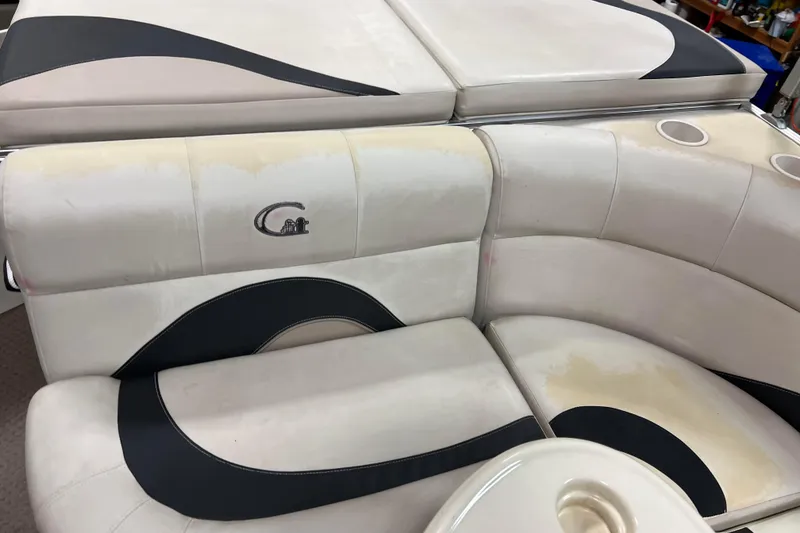 Slide: The Image of 2014 Avalon Grand Island 2485 QF boat interior with white and black seating. - 35