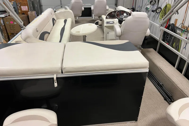 Slide: The Image of 2014 Avalon Grand Island 2485 QF pontoon boat interior with plush seating and helm. - 39