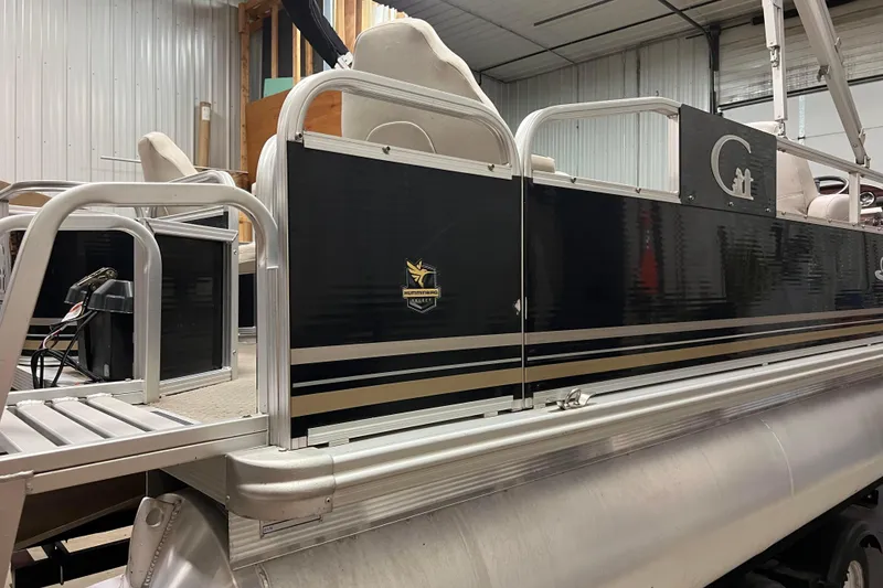 Slide: The Image of 2014 Avalon Grand Island 2485 QF pontoon boat in a storage facility. - 49