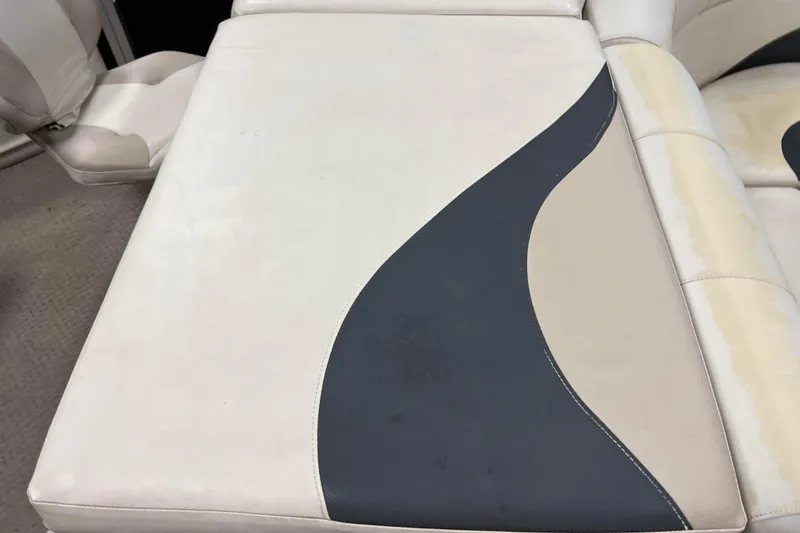 Slide: The Image of 2014 Avalon Grand Island 2485 QF boat seat with beige and black upholstery design. - 53