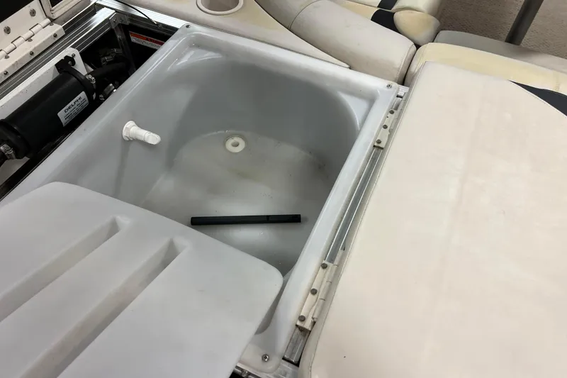 Slide: The Image of 2014 Avalon Grand Island 2485 QF boat interior with open storage compartment. - 59