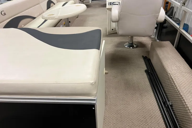Slide: The Image of Interior of 2014 Avalon Grand Island 2485 QF pontoon boat with beige seating and carpet. - 68