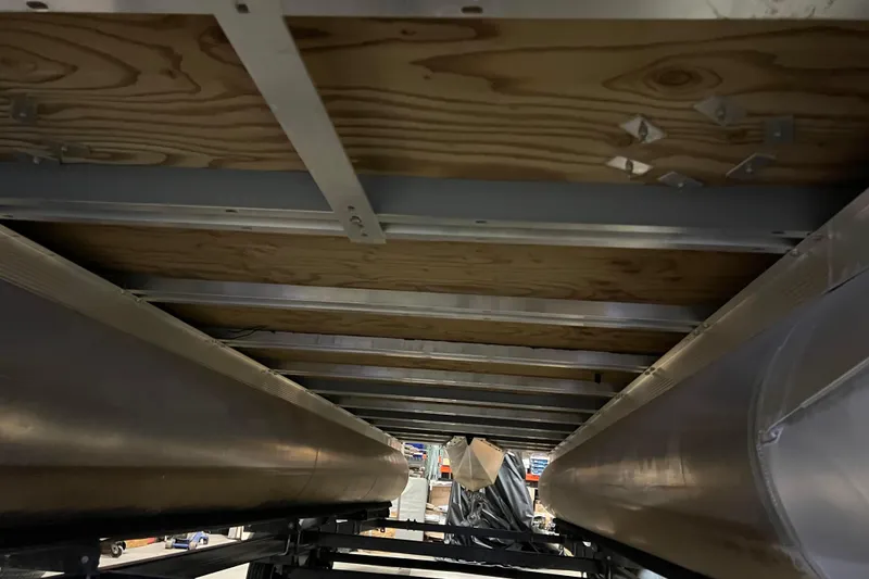 Slide: The Image of Underneath view of 2014 Avalon Grand Island 2485 QF pontoon boat structure. - 77