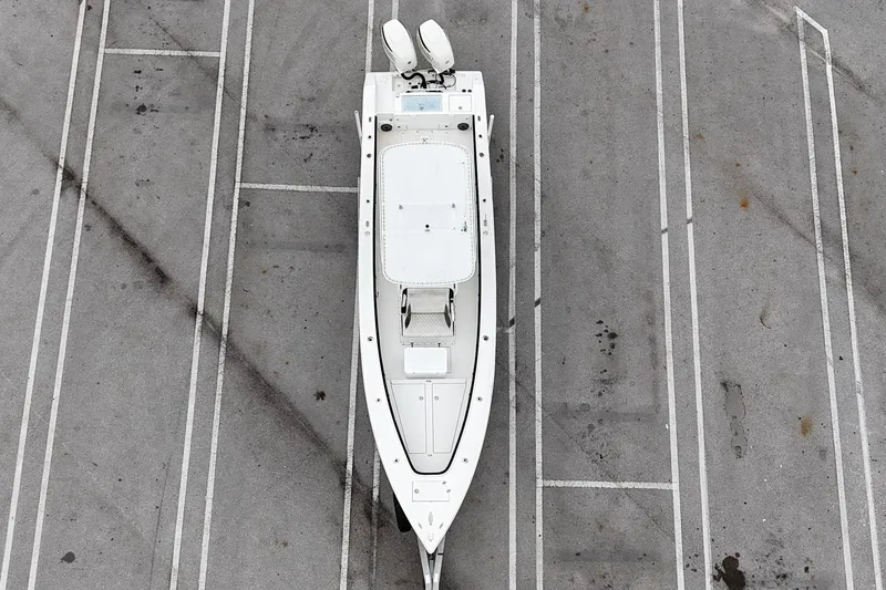 Slide: The Image of Aerial view of a 2002 Island Runner 31 boat in a parking lot. - 10