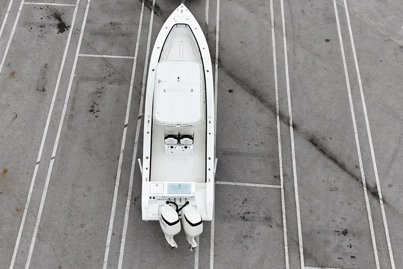 Slide: The Image of Aerial view of a 2002 Island Runner 31 boat parked on a concrete surface. - 5