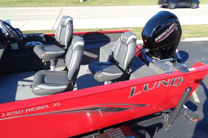 Slide: The Image of 2022 Lund 1650 Rebel XL SS boat with Mercury engine, featuring comfortable seating. - 4
