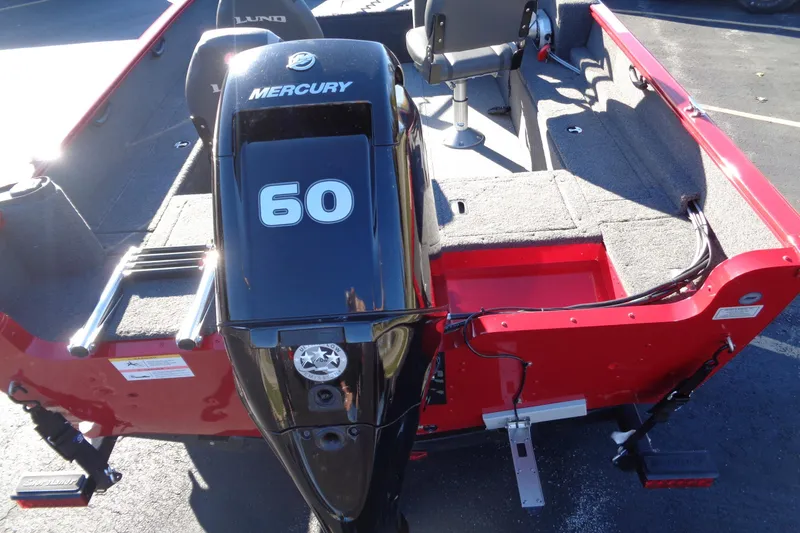 Slide: The Image of 2022 Lund 1650 Rebel XL SS boat with Mercury 60 engine, red exterior. - 8
