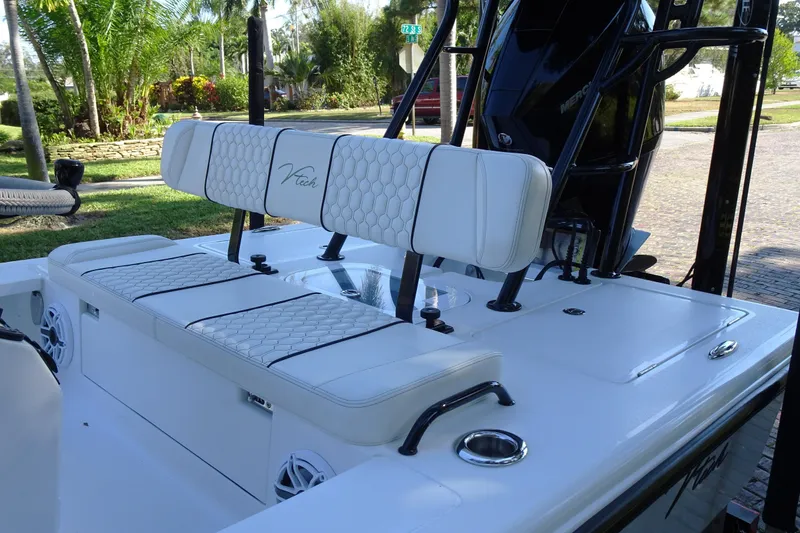 Slide: The Image of 2023 Vtech 18 boat interior with white cushioned seating and sleek design. - 11