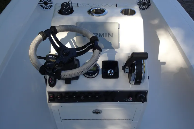 Slide: The Image of Boat control panel with steering wheel and Garmin system, Vtech 18 model, 2023. - 15
