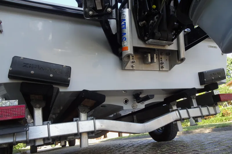 Slide: The Image of Rear view of a 2023 Vtech 18 boat with Zipwake system and trailer. - 16