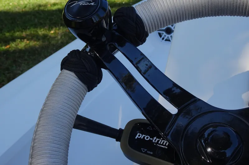 Slide: The Image of Steering wheel of 2023 Vtech model 18 boat with pro-trim control. - 24